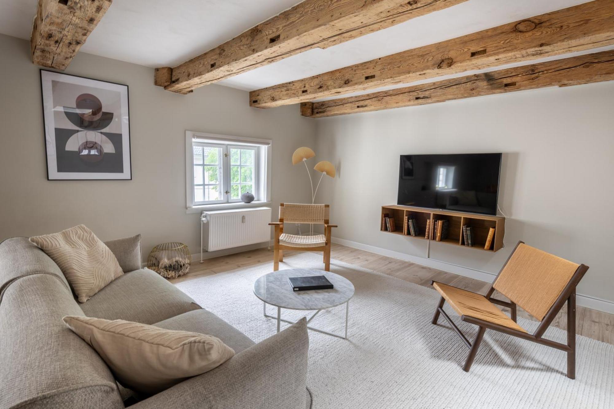 Apartment With Exposed Ceiling Beams Copenhagen